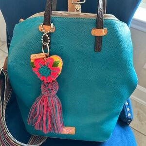 Consuela Blue and Brown Leather Backpack with Vibrant Tassel Charm
